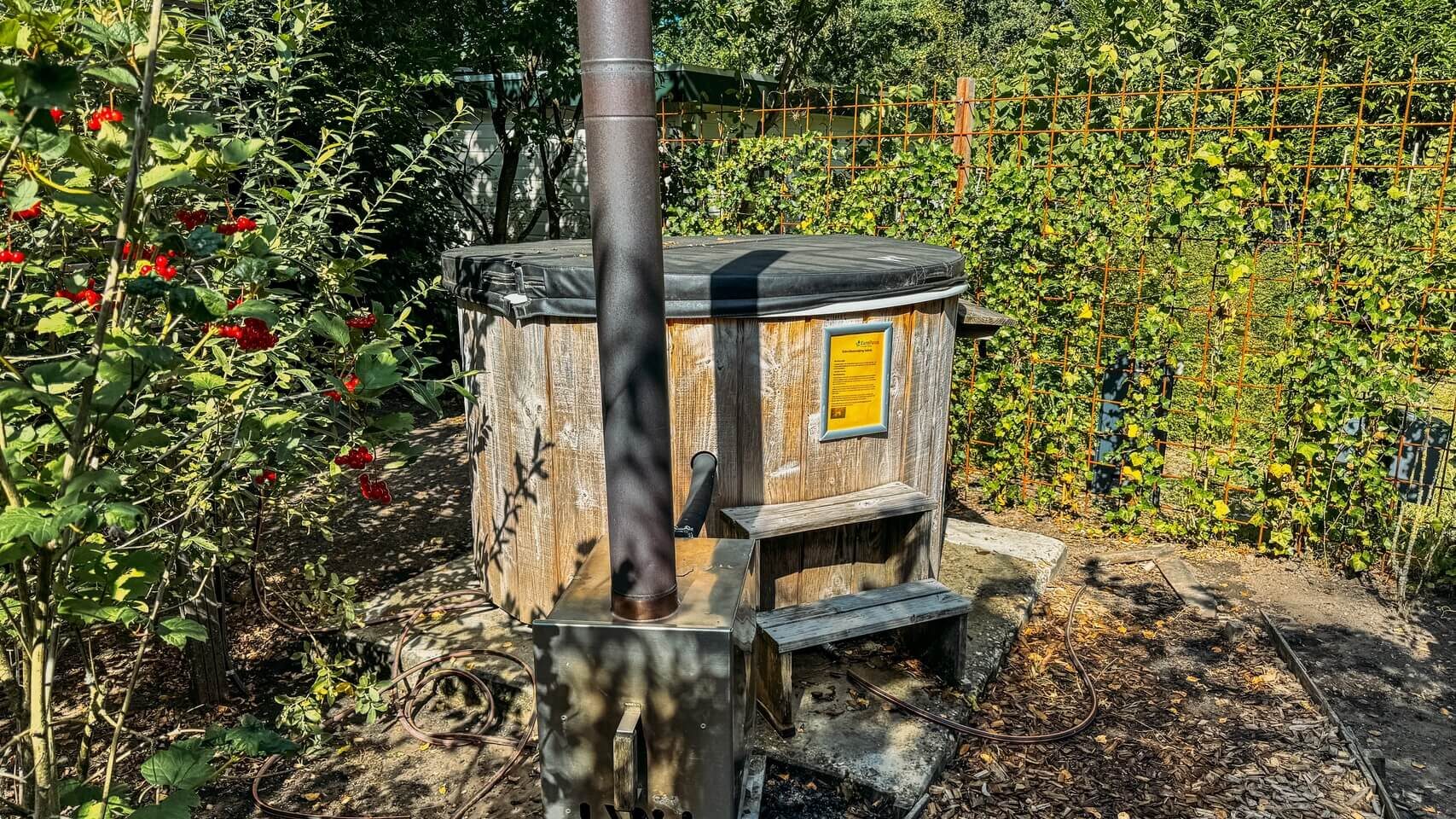 Wooden hot tub with chimney at the TinyCube